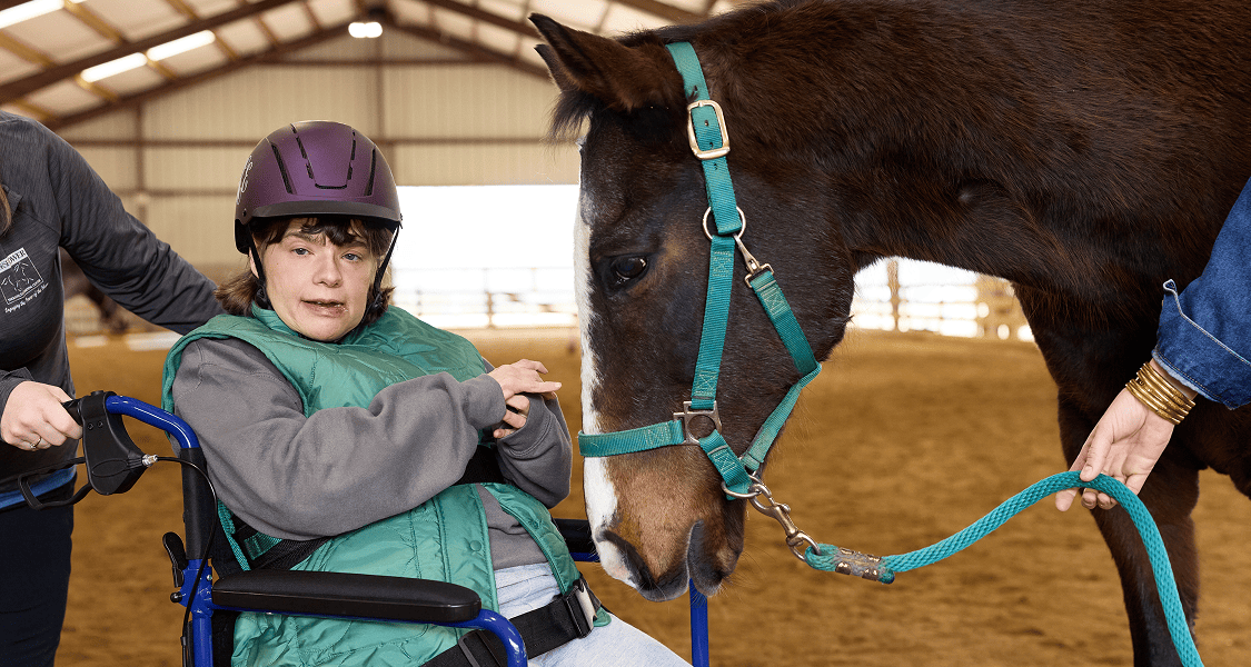 Shannon, age 54, living with Rett syndrome, with her mom mobile