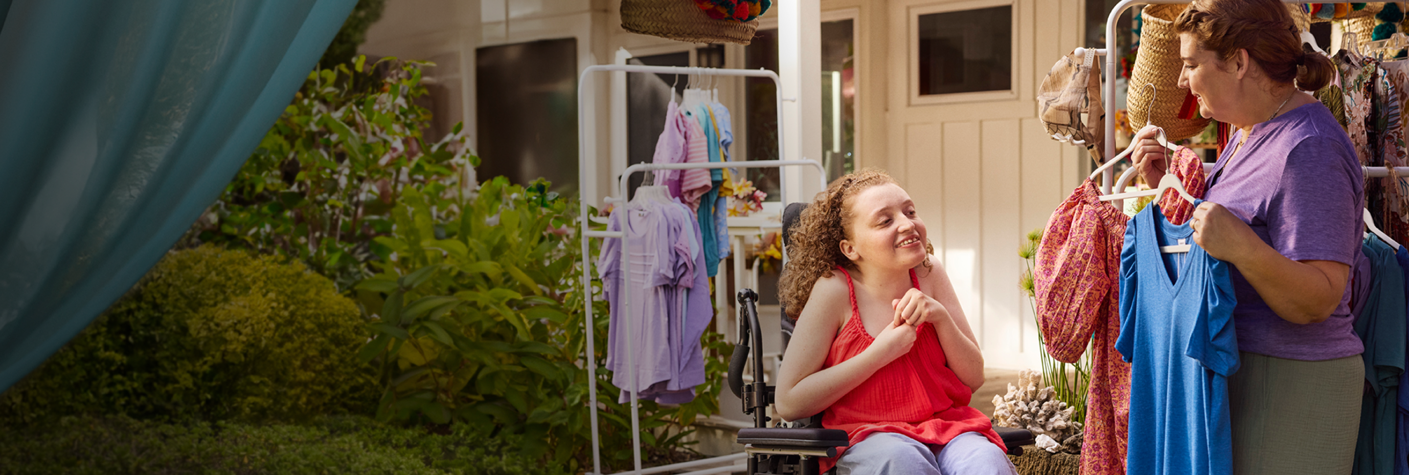 Maddy, age 21, living with Rett syndrome and on DAYBUE since 2020, with her mom. Graphic butterfly moves toward Maddy.